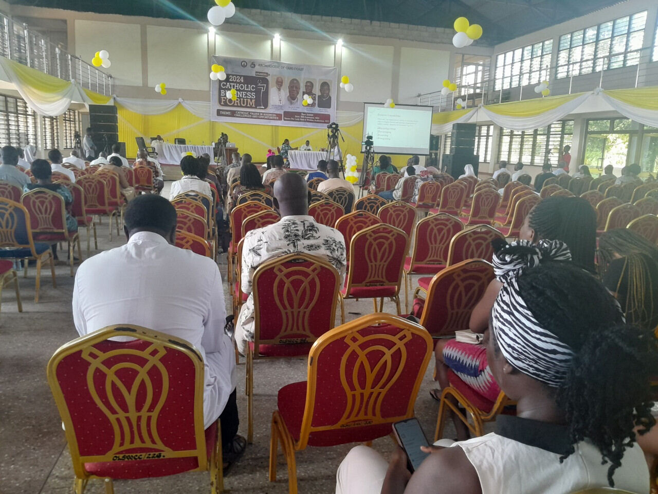 Seated audience during a conference session