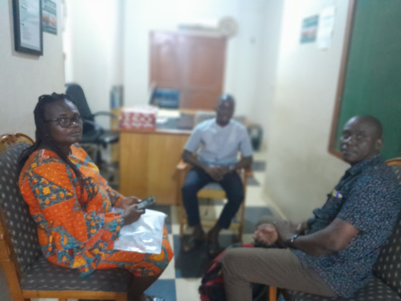 Stakeholders meeting around a table in an office