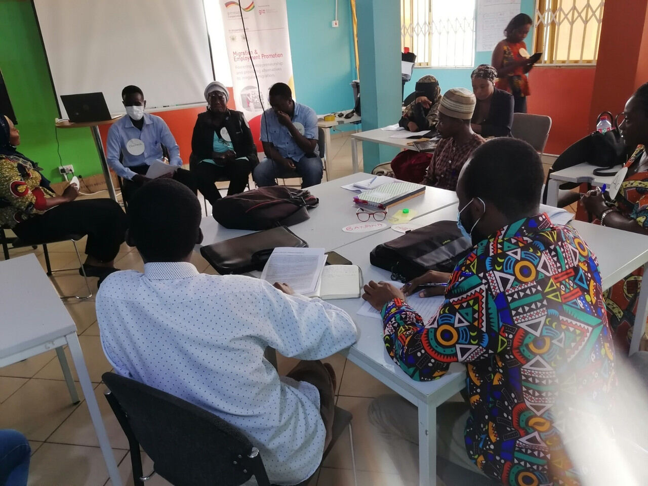 Participants in discussion around a roundtable