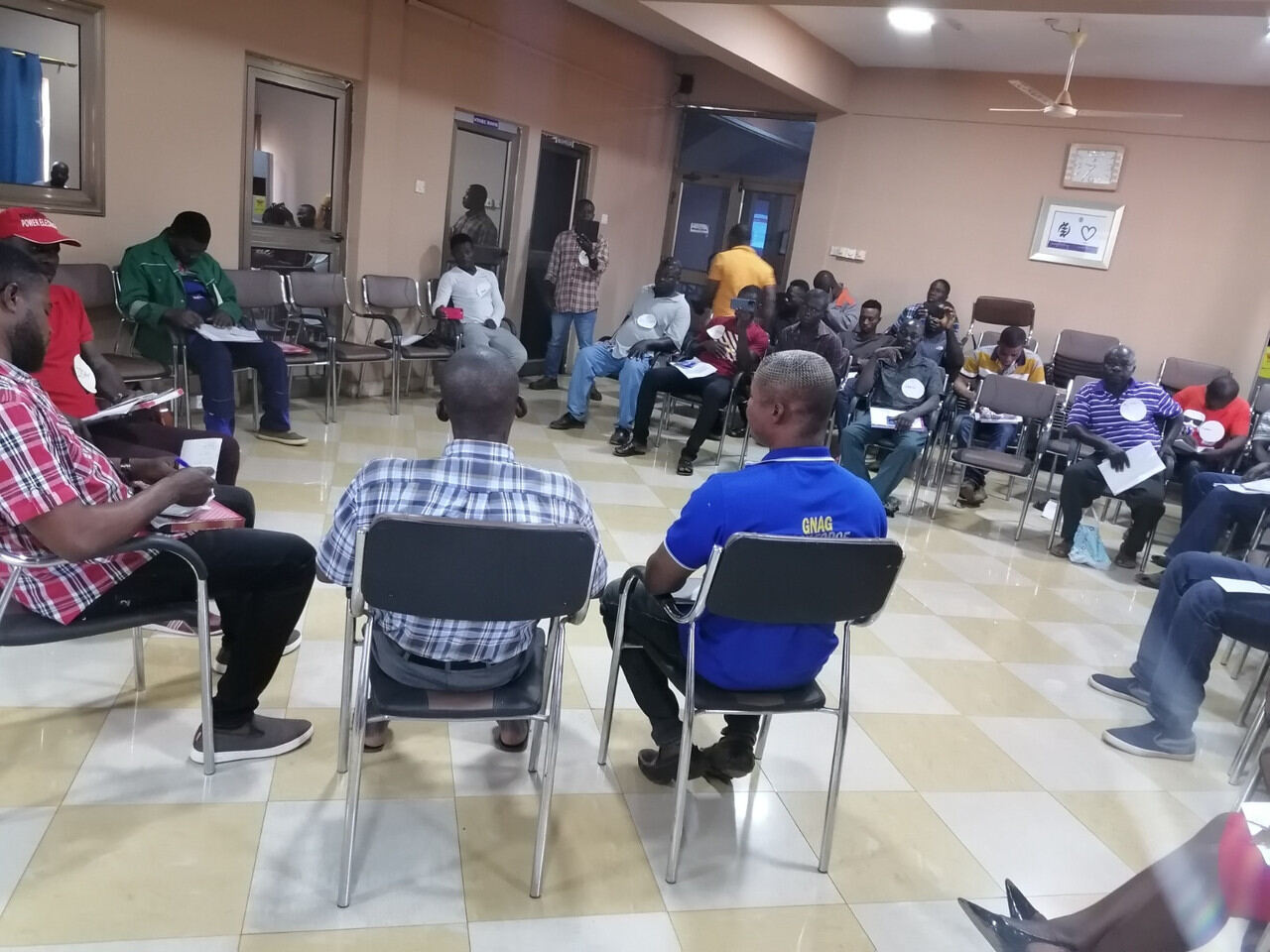 Participants seated at tables during a training session